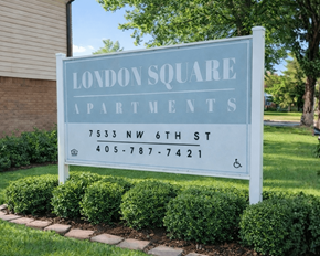 Oklahoma City apartment for rent - A sign for London Square Apartments is displayed in front of a building.