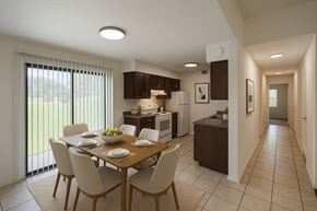 Rogers apartment for rent - A modern kitchen with a dining table set for four.