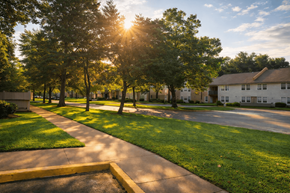 Oklahoma City apartment for rent - A sunny day in a residential neighborhood with houses and trees.