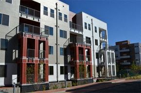 Denver apartment for rent - a row of apartment buildings on the side of a street