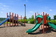 Hermitage apartment for rent - A playground with a red and green slide.