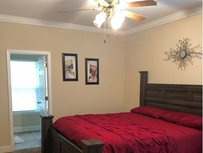 Columbus apartment for rent - a bedroom with a bed and a ceiling fan