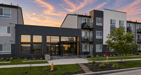 Denver apartment for rent - A modern apartment complex with a fire hydrant in front.