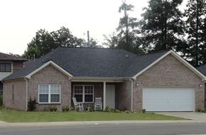 Columbus apartment for rent - a house with a lawn and a white garage door