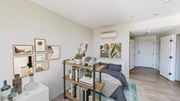 Boston apartment for rent - a bedroom with a bed and a bookshelf in front of it
