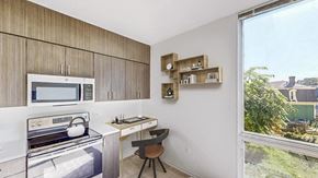 Boston apartment for rent - a kitchen with a stove and a microwave