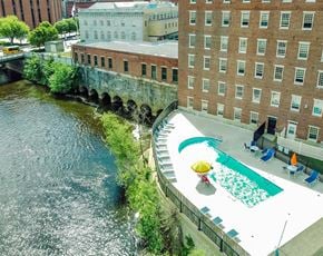 Lowell apartment for rent - Mass Mills apartments in lowell pool overhanging the merrimack river