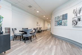 Quincy apartment for rent - a room with a table and chairs on the left and a hallway on the right
