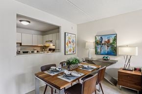 Shrewsbury apartment for rent - A dining room with a wooden table set for two.