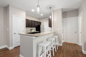 Hanover apartment for rent - A kitchen with white cabinets and a granite countertop.
