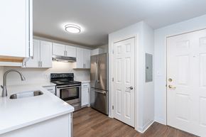 Salem apartment for rent - a renovated kitchen with white cabinets and stainless steel appliances