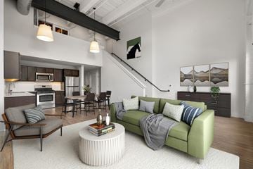 Mansfield apartment for rent - A living room with a green couch and a coffee table.