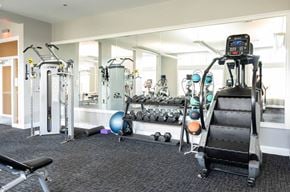 Weymouth apartment for rent - a gym with weights and other equipment in a building