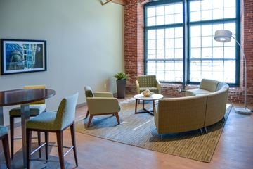 Lowell apartment for rent - a living room with a couch and chairs and a table