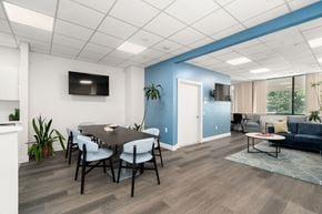 Boston apartment for rent - A modern dining room with a black table and chairs.