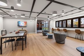 Chelsea apartment for rent - A modern dining room with a long table and chairs.