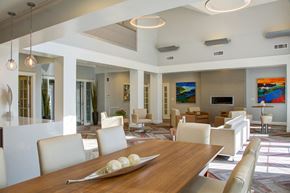 Lynnfield apartment for rent - A modern dining room with a wooden table and white chairs.