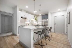 Billerica apartment for rent - a kitchen with a white counter top next to a doorway