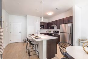 Boston apartment for rent - a kitchen with a large center island with a breakfast bar