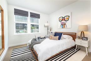 Boston apartment for rent - a bedroom with a bed and two windows