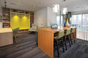Boston apartment for rent - a room with a table and chairs with a laptop on it