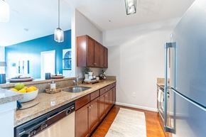 Providence apartment for rent - a kitchen with wood cabinets and granite countertops