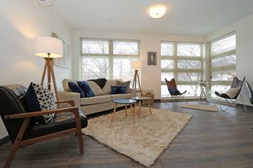 Roslindale apartment for rent - a living room with a couch and chairs and a rug