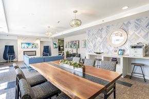Chelsea apartment for rent - The community lounge at Parkside Commons with a long wooden table and chairs