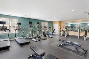 Chelsea apartment for rent - A gym with treadmills, exercise bikes, and other equipment at Parkside Commons
