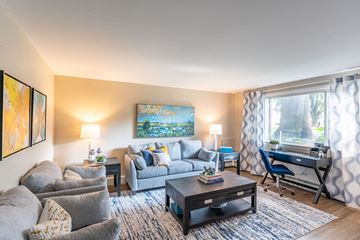 Framingham apartment for rent - a living room with a couch and a table