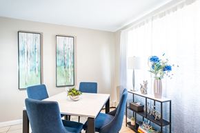 Framingham apartment for rent - a dining room with a white table and blue chairs