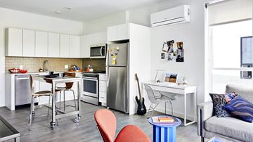 Jamaica Plain apartment for rent - A modern kitchen with a dining table and chairs.