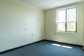 Taunton apartment for rent - A room with a window and a carpeted floor.