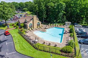 Shrewsbury apartment for rent - an aerial view of a swimming pool in front of a house