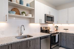 Bellingham apartment for rent - The Curtis kitchen with granite counters, electric range, stainless appliances