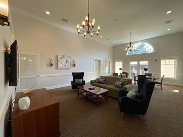 Dracut apartment for rent - a large living room with couches and chairs and a table