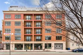 Somerville apartment for rent - a large brick building with a parking garage in front of it  at Union 346, Somerville, MA, 02143