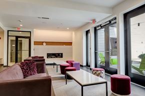 Jamaica Plain apartment for rent - Clubhouse with lounge seating and a fireplace