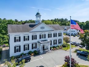 Hanover apartment for rent - A white building with a green dome and an American flag on top.