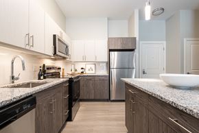 Attleboro apartment for rent - One Wall Street Kitchen with island stainless steel appliances and granite countertops