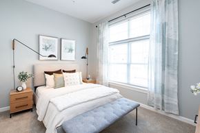 Attleboro apartment for rent - One Wall Street Bedroom Bed with large open windows and sunlight