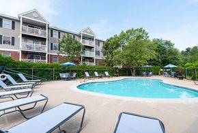 Salem apartment for rent - pool deck and foliage with umbrellas