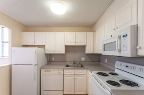 Andover apartment for rent - a kitchen with white appliances and white cabinets