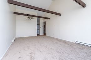 Nahant apartment for rent - a bedroom with white walls and a ceiling fan