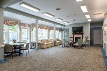 Hanover apartment for rent - A spacious living room with a fireplace and a television.