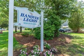 Hanover apartment for rent - A sign for Hanover Legion Senior Housing stands in a landscaped area.