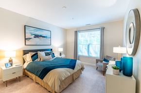 Amesbury apartment for rent - a bedroom with a large bed and a window