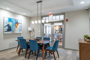 Amesbury apartment for rent - a dining room with blue chairs and a wooden table