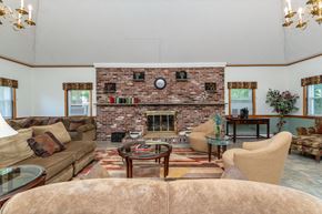 Melrose apartment for rent - clubhouse with extra seating, elegant decorations, and a fireplace