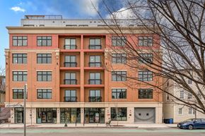 Somerville apartment for rent - a large brick building with a parking garage in front of it at Union 346, Somerville, MA
